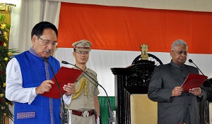 The Governor of Arunachal Pradesh Shri Tathagata Roy administering the oath of office to Dr Joram Begi as the State Chief Information Commissioner of Arunachal Pradesh at Raj Bhavan, Itanagar on 10th July 2016.